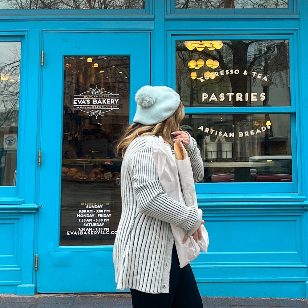Soft blue sweater with gold buttons